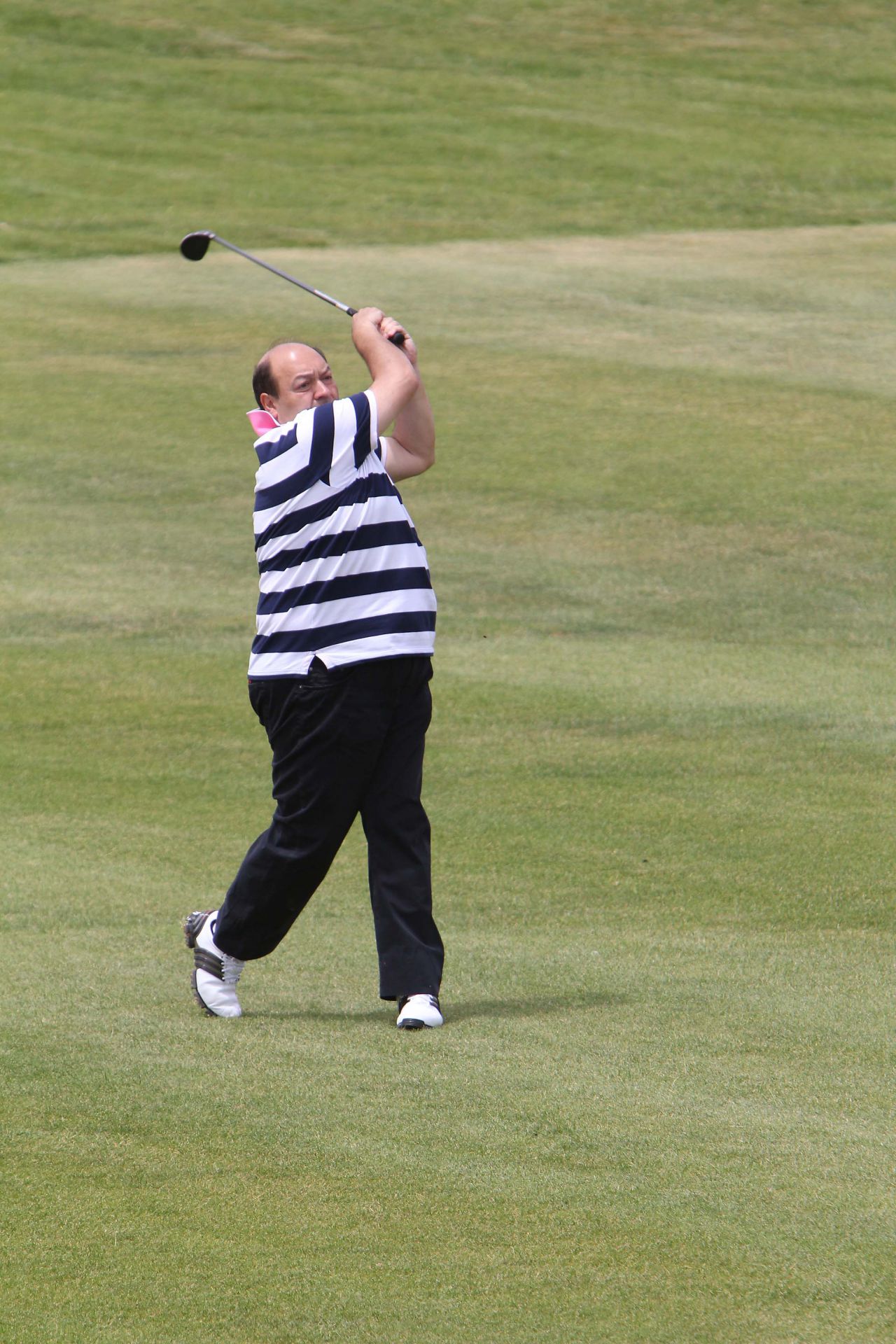 Jugando al golf, una de sus pasiones
