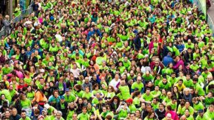 Madrid se tiñe de verde en la carrera contra el cáncer