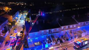 Incendio en una vivienda unifamiliar adosada situada en la calle Tejera Negra, en el barrio de Perales del Río, en Getafe.